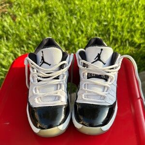 Jordan 11 Black and White Sneakers with Glossy Finish